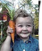 Farmgirl Jaime's adorable little 'Bee' holding up her carrot